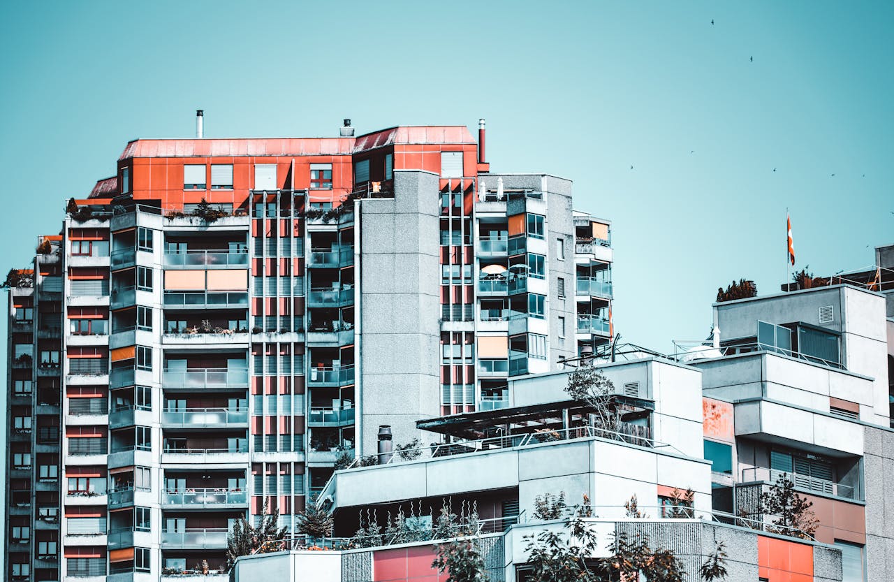 Modern residential buildings in Bern, featuring glass windows and vibrant design.